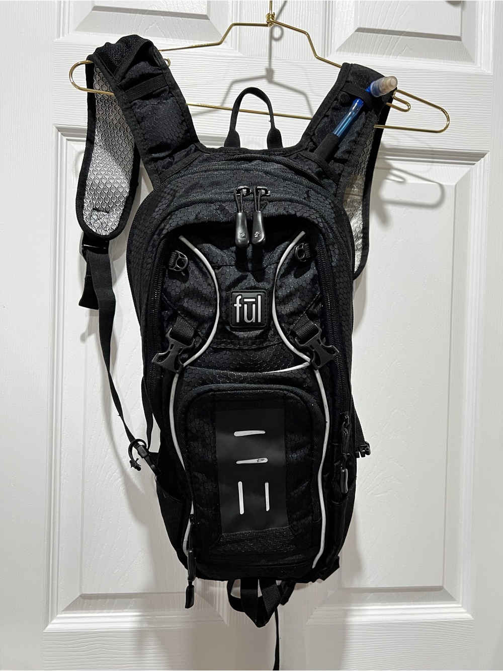 FUL Unisex Multi Sport Hydration Cargo Black With Hydration bladder plastic bag